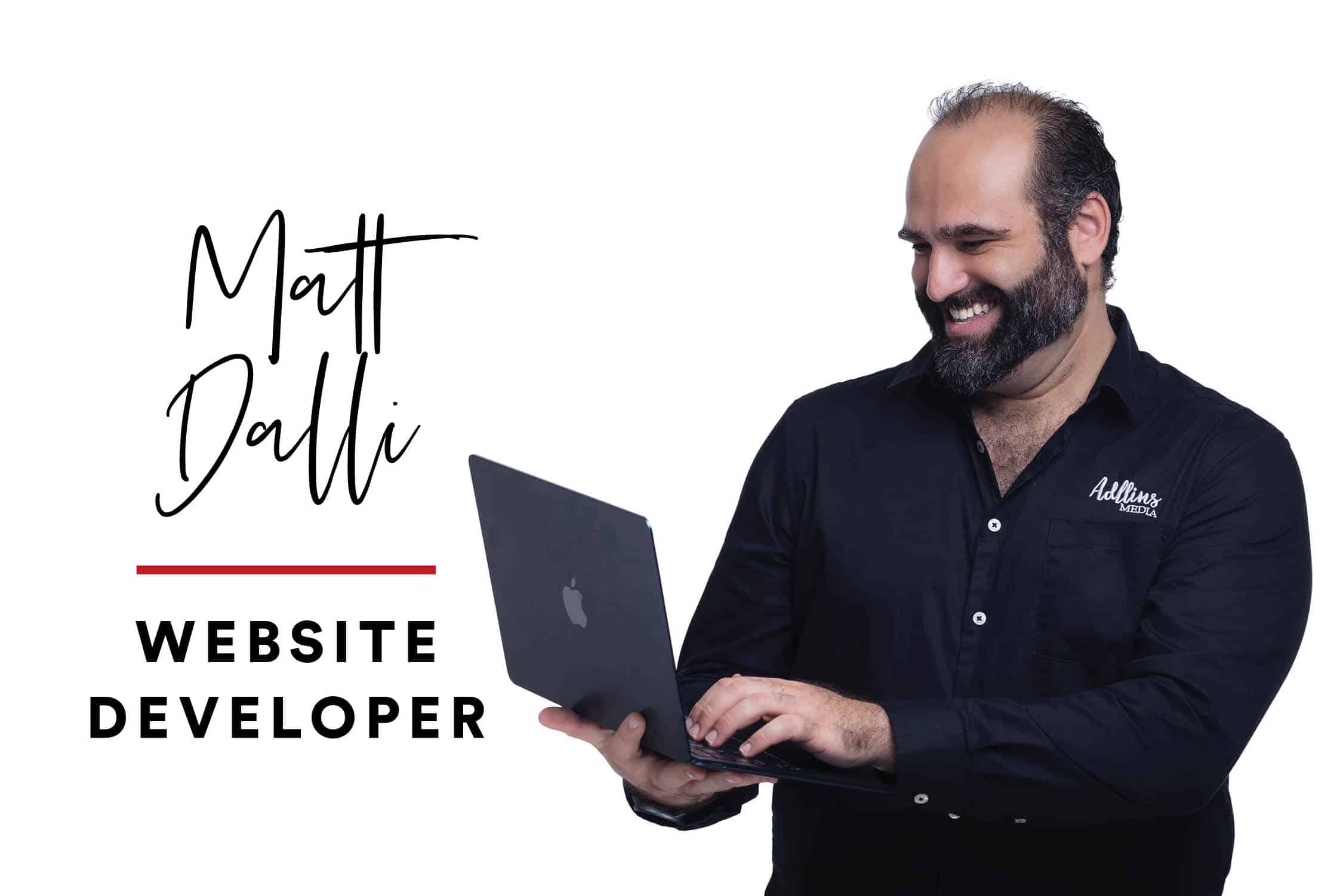 Adllins Media Web Developer Matt Dalli holds a laptop and smiles.